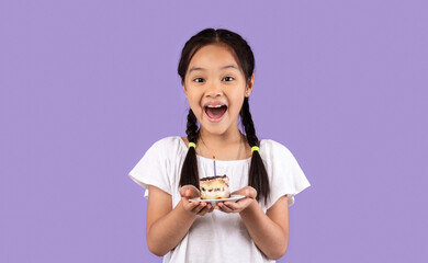 Excited Japanese Kid Girl Holding Birthday Cake Over Purple Background