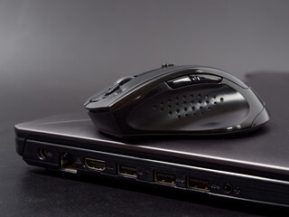 black modern computer mouse on dark background
