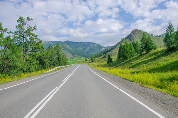 Fototapeta premium landscape road goes away to Altai mountains in Russia