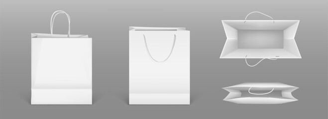 White paper shopping bags front and top view. Vector realistic mockup of blank packet with handles isolated on gray background. Template for corporate design on cardboard bag for store or market