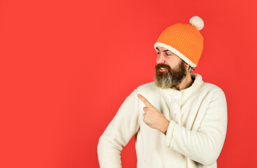 Winter clothes and accessories. Feeling good. Hipster style. Head in warm hat. Mature emotional hipster funny style accessory. Bearded hipster. Handsome man knitted hat with pom pom. Fashion concept