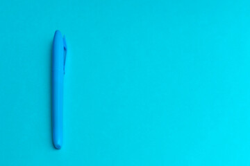 Magenta colored highlighters at cyan blue background with copy space
