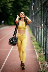 Young sporty woman on running track. Beautiful woman in sportswear..