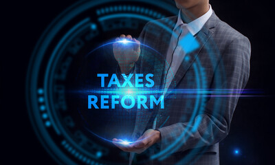 Fototapeta na wymiar Business, Technology, Internet and network concept. Young businessman working on a virtual screen of the future and sees the inscription: Taxes reform