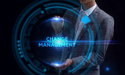 Business, Technology, Internet and network concept. Young businessman working on a virtual screen of the future and sees the inscription: Change management