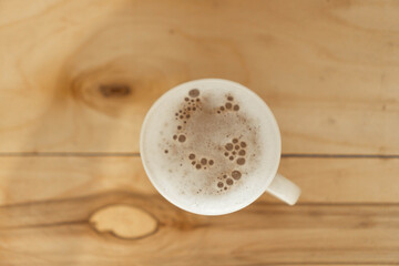 cappuccino coffee on wooden texture