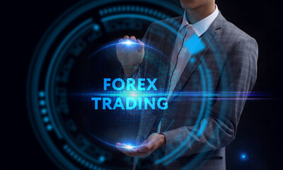 Business, Technology, Internet and network concept. Young businessman working on a virtual screen of the future and sees the inscription: Forex trading