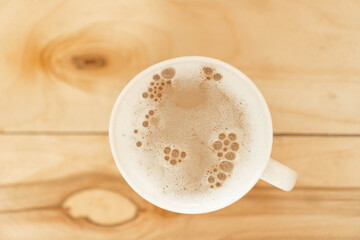cappuccino coffee on wooden texture