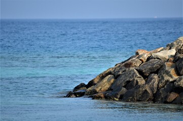 calm view of seashore of Maldives, rocks, stones