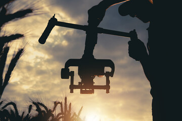 Handheld Video Camera Professional Stabilizator in Use While Taking Documentary Scene © Tomasz Zajda