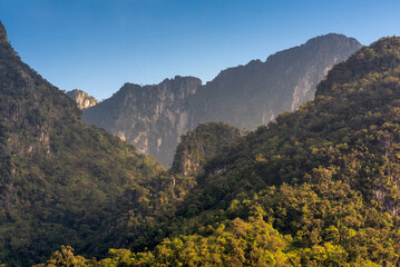 Fototapeta premium Nature view of Doi Luang Chiang Dao mountain with blue sky,the famous mountain for tourist to visit in Chiang Mai,Thailand.