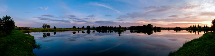 Wonderful panorama of the mountains. Horses on a mountain meadow. Summer panorama landscape in the mountains. Ukraine, Carpathians. Beautiful nature villages. Picture of wildlife