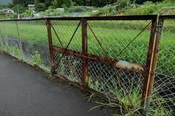 Old iron gates to prevent trespassing in the fields