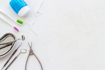 Pattern of dentist equipment. Tools, toothbrushes, dental floss flat lay