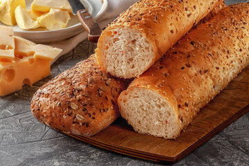 Fresh bread with sesame seeds, seeds and oatmeal on the table