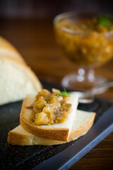 cooked eggplant caviar with spices on a wooden table