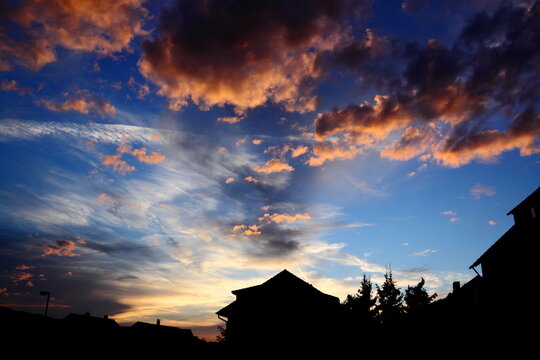 Sunset behind silhouette of house