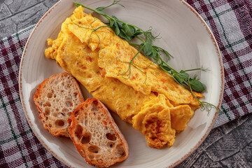 Fresh French omelet with fresh vegetables. Vegetarian food