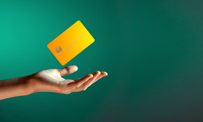Close up female hand holds levitating template mockup Bank credit card with online service isolated...