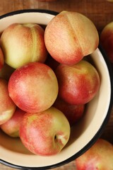 Juicy nectarines on a wooden table macro