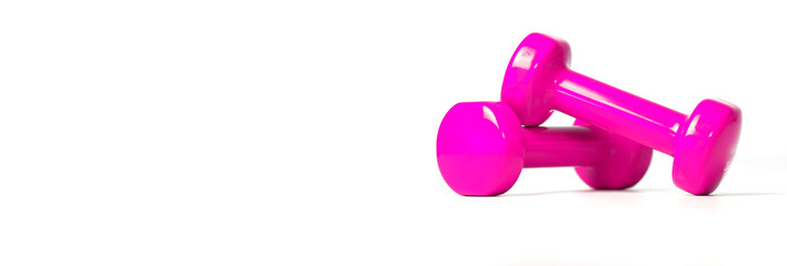 Banner of fitness concept with pink dumbbells, and a bottle of water, on a white background.