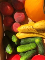 Seasonal fruits and vegetables in a wooden box