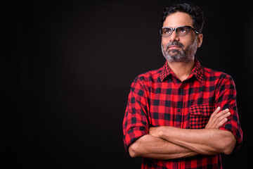 Portrait of mature bearded Indian hipster man