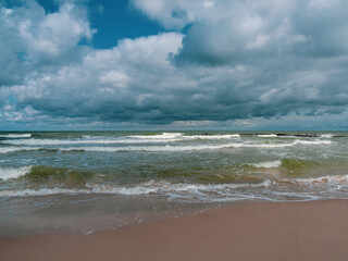 strong swell at the Baltic Sea and the sky is blue and cloudy