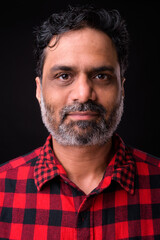 Portrait of mature bearded Indian hipster man