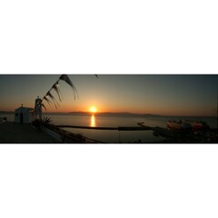Sunrise at the Chapel of St Nicholas next to the port of Rafina 