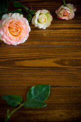 small bouquet of beautiful pink roses on a wooden table