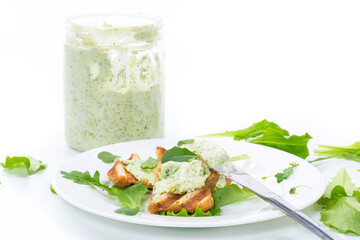 green bread spread of arugula, curds and eggs with fried toast