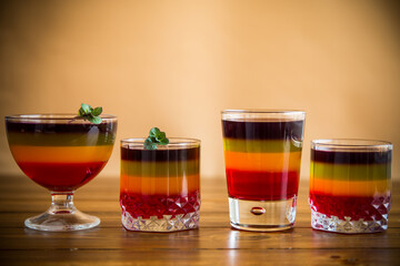 Sweet multi-colored fruit puff jelly in a glass cup