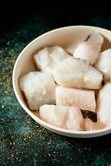 Fototapeta na wymiar some pieces of frozen uncooked codfish
