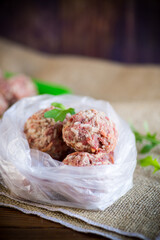 frozen raw meatballs from beef and pork with carrots and rice