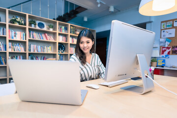 Young business entrepreneur working on the smart computer at co-workspace office.Conceptual for startup small businesses starting own company and online marketing.