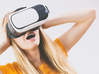 Girl wearing virtual reality goggles.