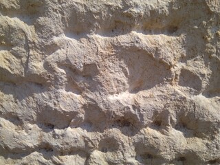 The structure of the sandstone wall close-up, abstraction.