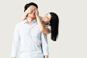 Happy Girlfriend Covering Eyes Of Man With Hands