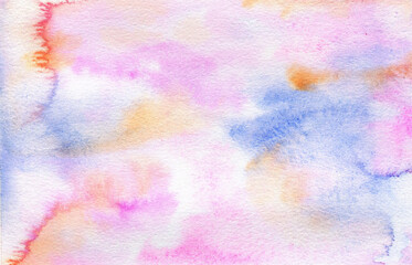 Watercolor texture on paper in pink, purple, blue and orange colors. Hand-painted abstract watercolor wash. 