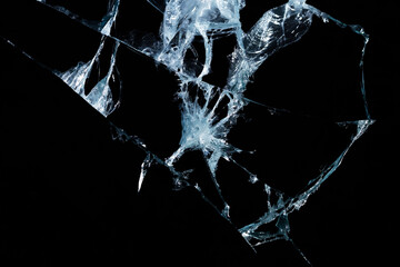 broken mirror glass on a colored and black background in cracks in the form of an isolated image abstraction