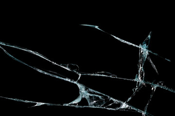 broken mirror glass on a colored and black background in cracks in the form of an isolated image...