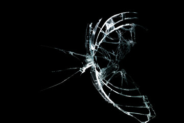 broken mirror glass on a colored and black background in cracks in the form of an isolated image abstraction