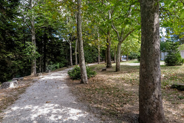 Dirt path in a wooded park around Spanish Fort in the city of Aquila, commune of L´aquila, Abruzzo region, Italy