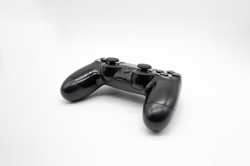 Black gaming controller on white background, Isolated, Back angle.