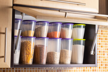 Storing cereals in plastic containers for cooking in the kitchen