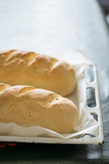 Fresh baked homemade bread taken out from oven.