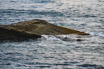 waves crashing on rocks