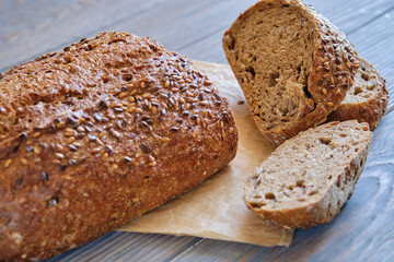 Rye and wheat bread with sunflower seeds on a wooden table