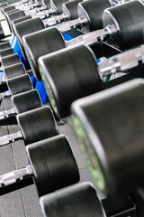 Fototapeta na wymiar Close up image of Fitness equipment dumbbells weight,Gym background 